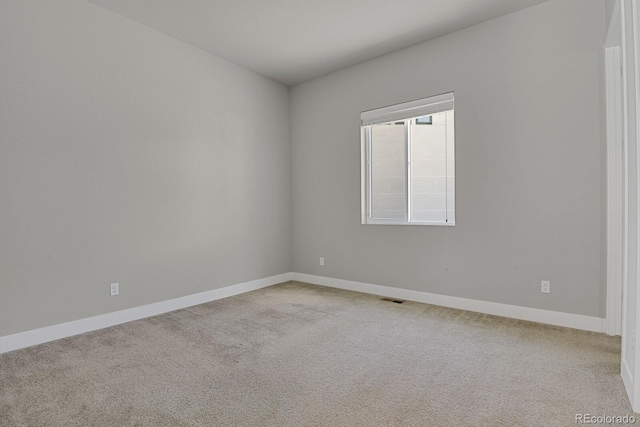 view of carpeted spare room