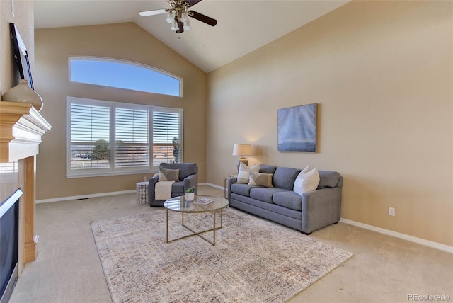 carpeted living room featuring high vaulted ceiling and ceiling fan