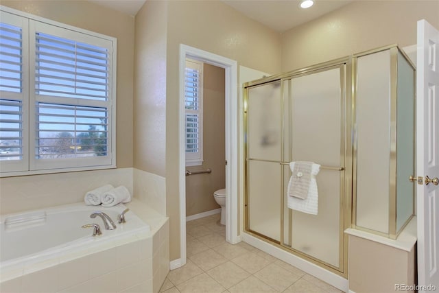 bathroom with shower with separate bathtub, tile patterned floors, and toilet