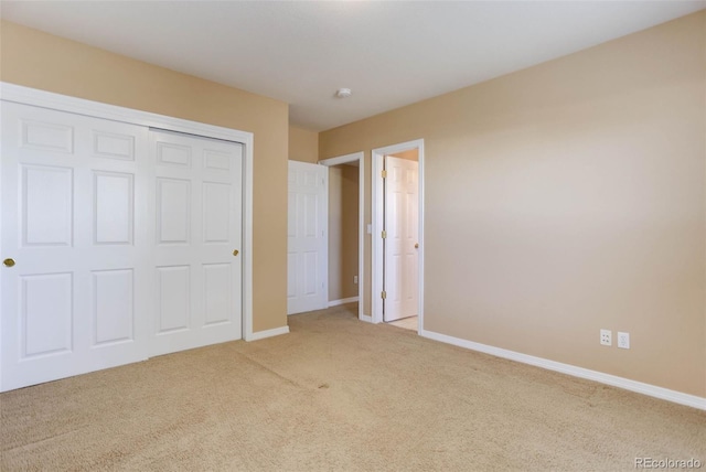 unfurnished bedroom featuring a closet and carpet