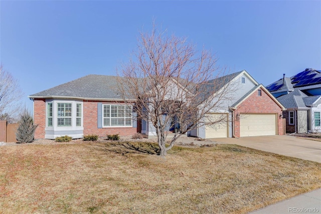 single story home featuring a garage and a front yard