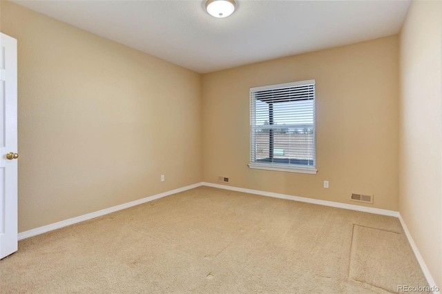 unfurnished room with carpet floors