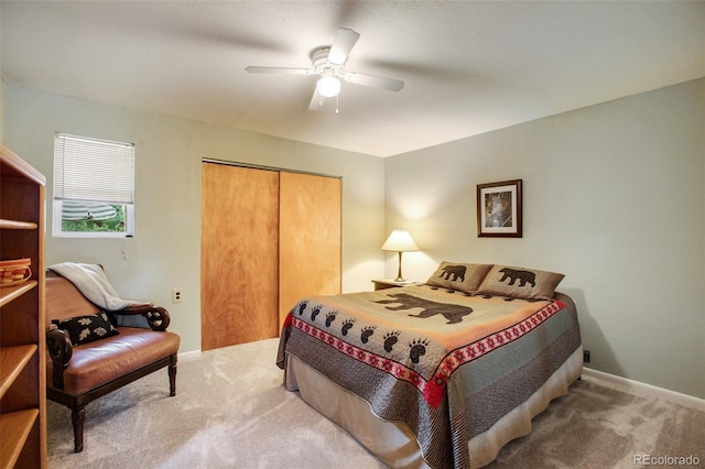 bedroom with carpet, ceiling fan, and a closet
