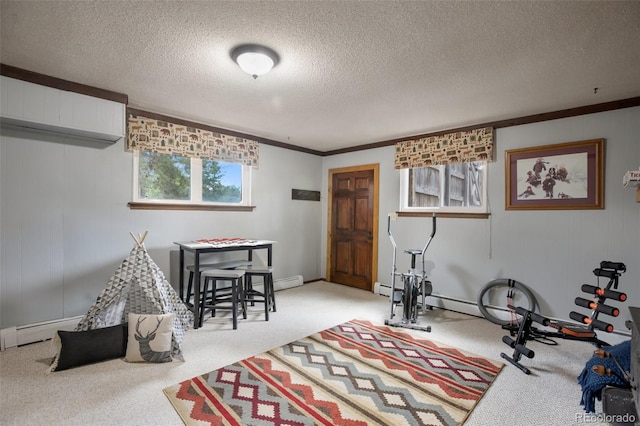 workout area featuring a baseboard heating unit, a textured ceiling, crown molding, and carpet