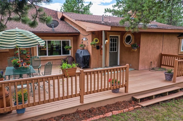 wooden terrace with grilling area