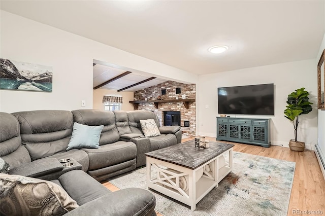 living room with lofted ceiling with beams, a fireplace, and wood-type flooring