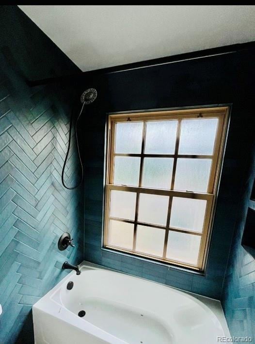 bathroom featuring  shower combination