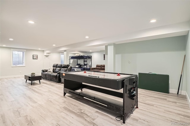 recreation room with light wood-type flooring