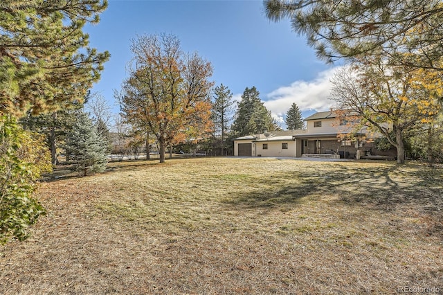 view of yard featuring a garage