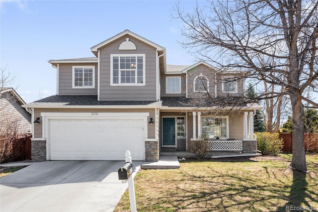 view of front of property featuring concrete driveway, an attached garage, a front yard, fence, and covered porch