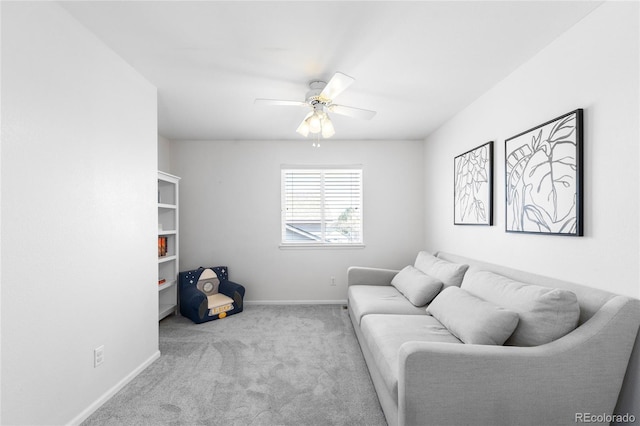 living room with baseboards, a ceiling fan, and carpet floors