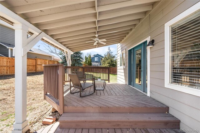 wooden deck featuring fence and ceiling fan