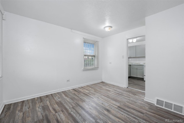 3715 N Jackson St, Denver, CO 80205 - unfurnished living room with wood finished floors and baseboards