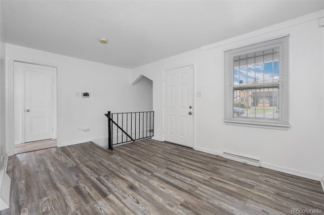 3715 N Jackson St, Denver, CO 80205 - additional living space featuring wood finished floors, baseboards, and a baseboard radiator