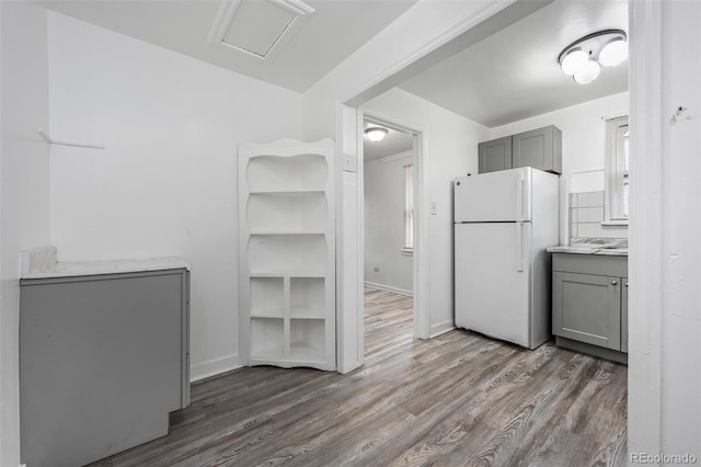 3715 N Jackson St, Denver, CO 80205 - kitchen with freestanding refrigerator, gray cabinetry, dark wood finished floors, and baseboards