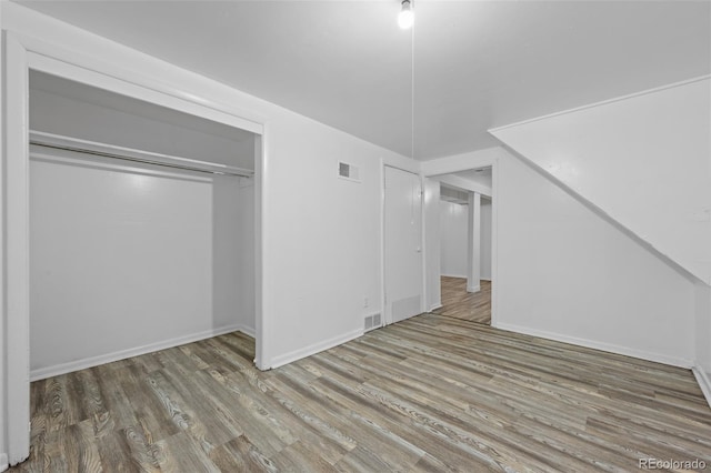 3715 N Jackson St, Denver, CO 80205 - below grade area featuring wood finished floors and baseboards