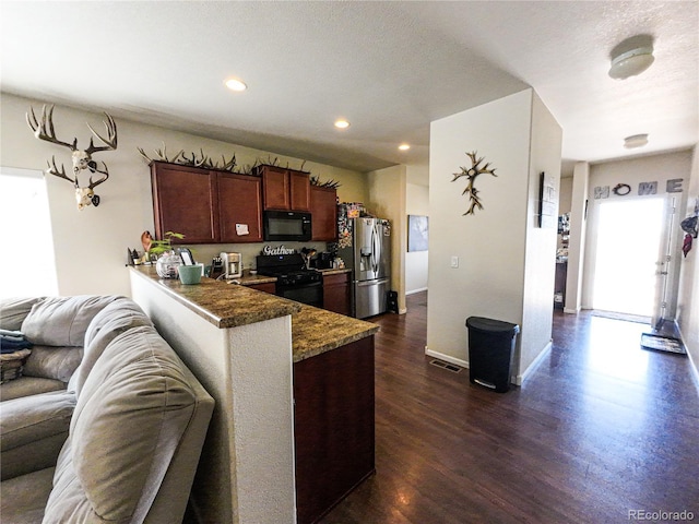 kitchen with recessed lighting, baseboards, open floor plan, black appliances, and dark wood-style floors