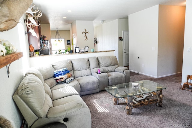 living area with recessed lighting, baseboards, and carpet floors