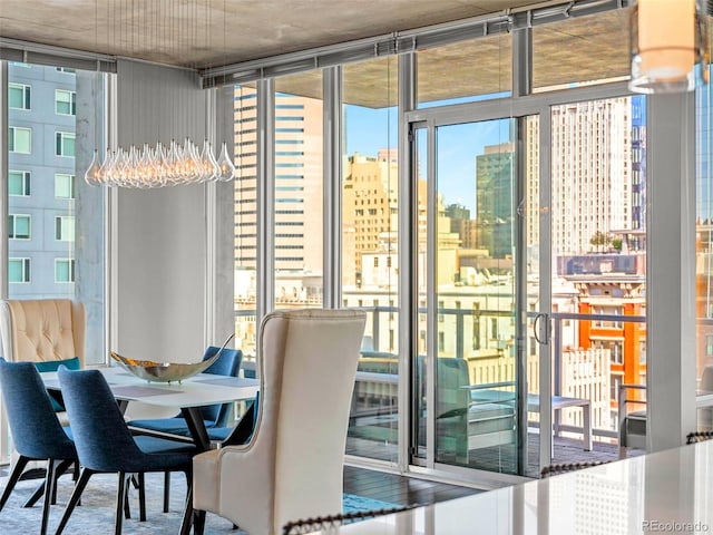 entryway featuring a healthy amount of sunlight, a view of city, and expansive windows