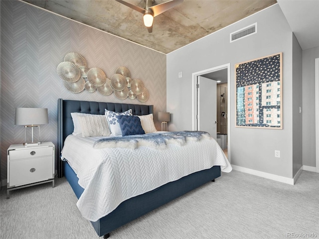 bedroom featuring visible vents, baseboards, carpet, and wallpapered walls