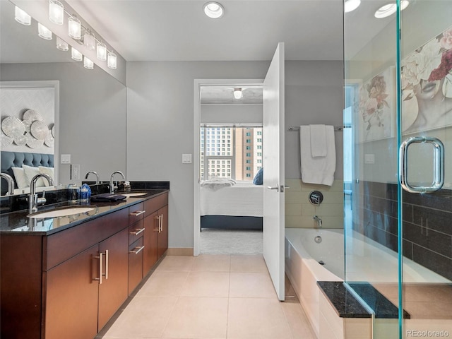 bathroom featuring ensuite bath, an enclosed shower, a sink, and tile patterned floors