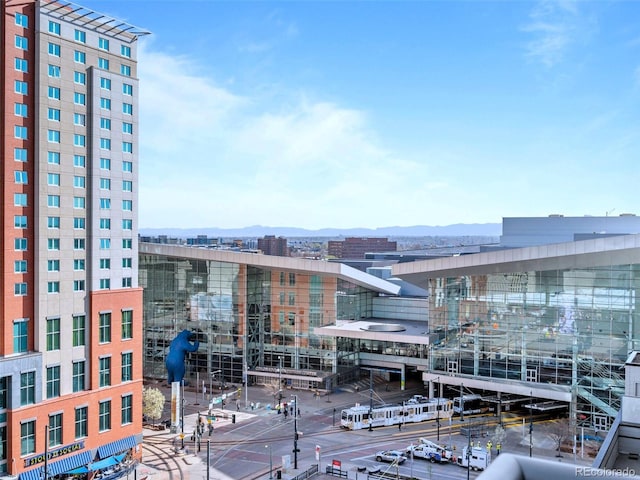 property's view of city with a mountain view