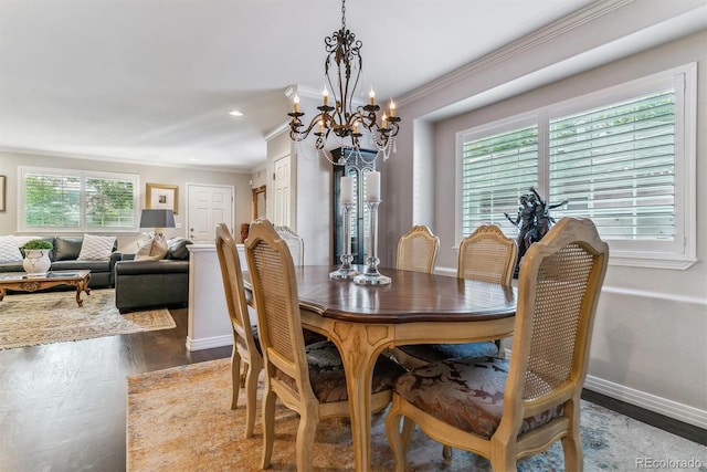 dining space featuring crown molding, baseboards, wood finished floors, and recessed lighting