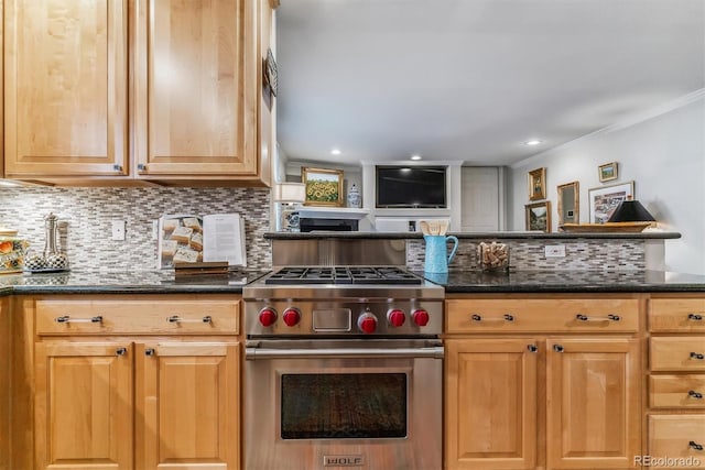 kitchen with recessed lighting, designer range, tasteful backsplash, dark stone countertops, and crown molding