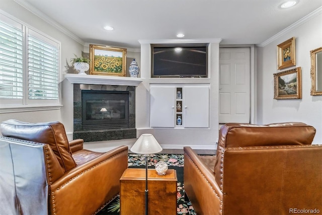 living area with ornamental molding, a premium fireplace, and recessed lighting