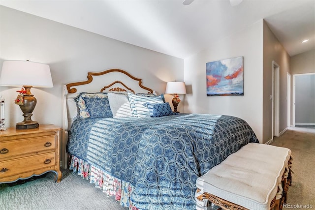 carpeted bedroom featuring vaulted ceiling and a ceiling fan