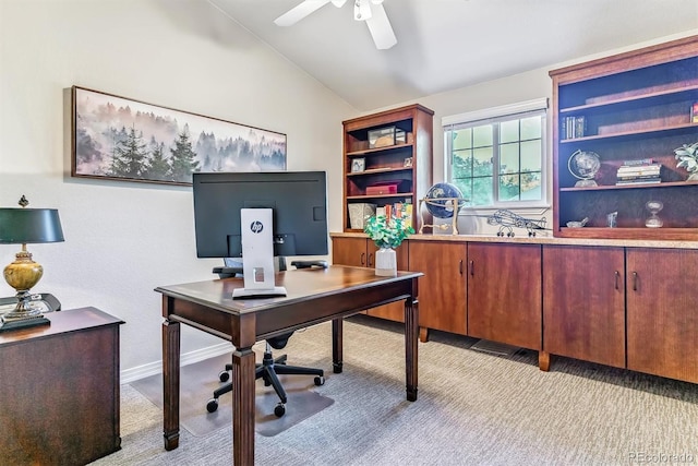 office with lofted ceiling, ceiling fan, and baseboards