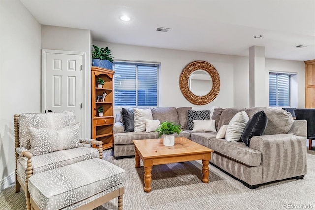 living room featuring visible vents, light colored carpet, and recessed lighting