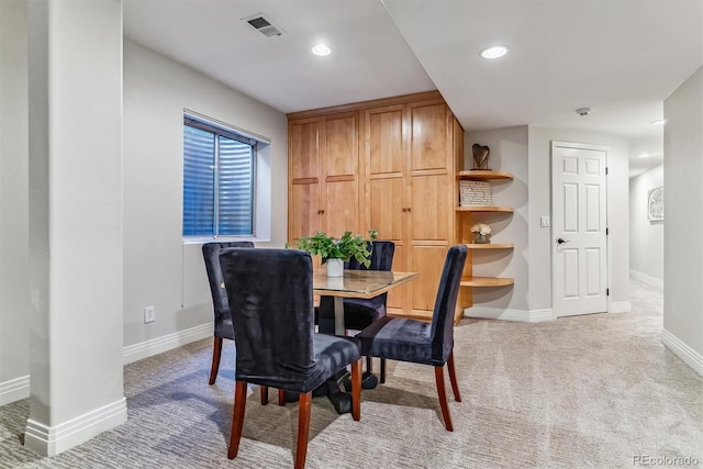 dining room featuring baseboards, recessed lighting, visible vents, and light colored carpet