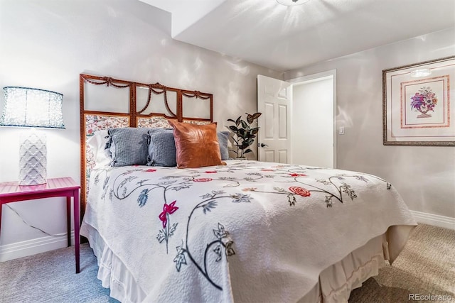 carpeted bedroom with baseboards