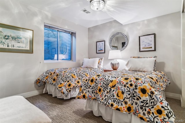 bedroom with baseboards, visible vents, and carpet flooring