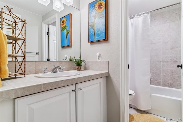 full bathroom featuring vanity, toilet, and shower / tub combo with curtain