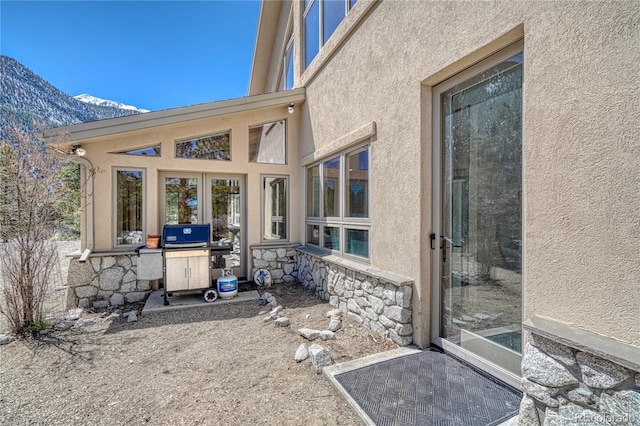 view of patio / terrace featuring area for grilling and a mountain view