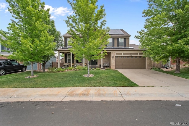 obstructed view of property with a front lawn, covered porch, and solar panels