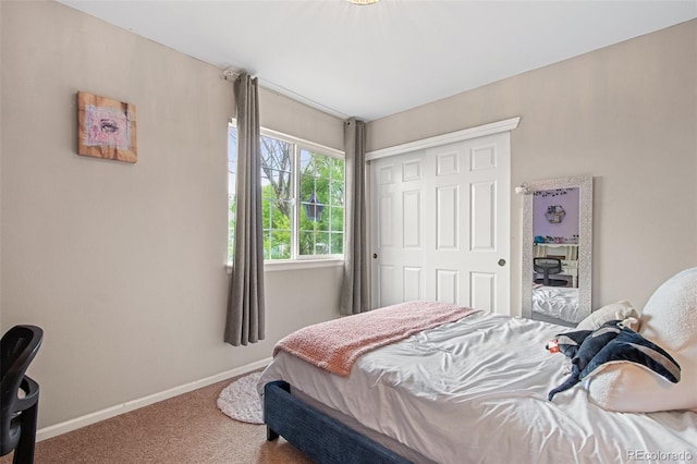 carpeted bedroom featuring a closet