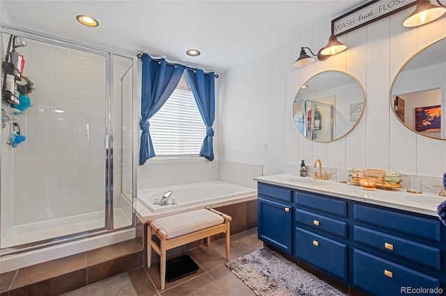 bathroom with vanity, tile patterned flooring, and shower with separate bathtub