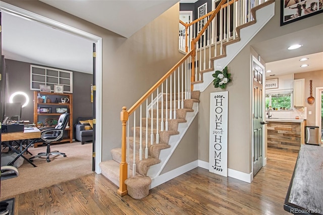 stairway with wood-type flooring