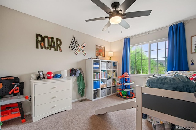 carpeted bedroom featuring ceiling fan