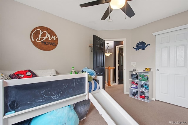 bedroom featuring ceiling fan and carpet flooring