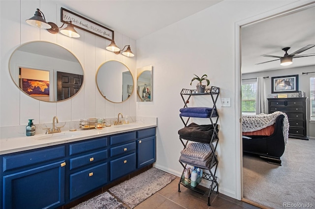 bathroom featuring ceiling fan, vanity, and tile patterned flooring