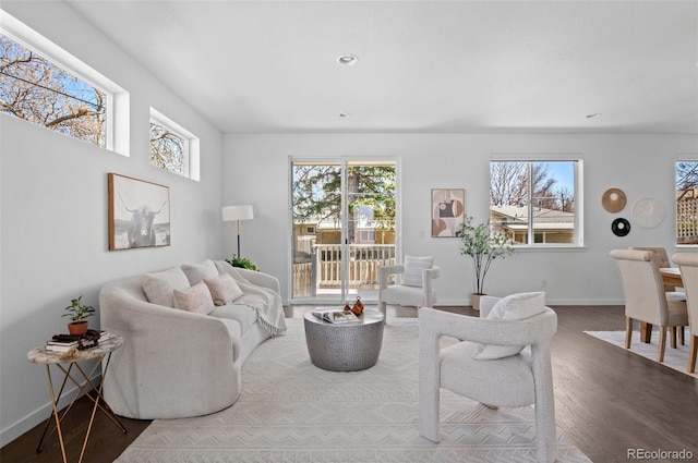 living room featuring recessed lighting, baseboards, plenty of natural light, and wood finished floors