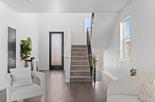 stairs with baseboards and wood finished floors