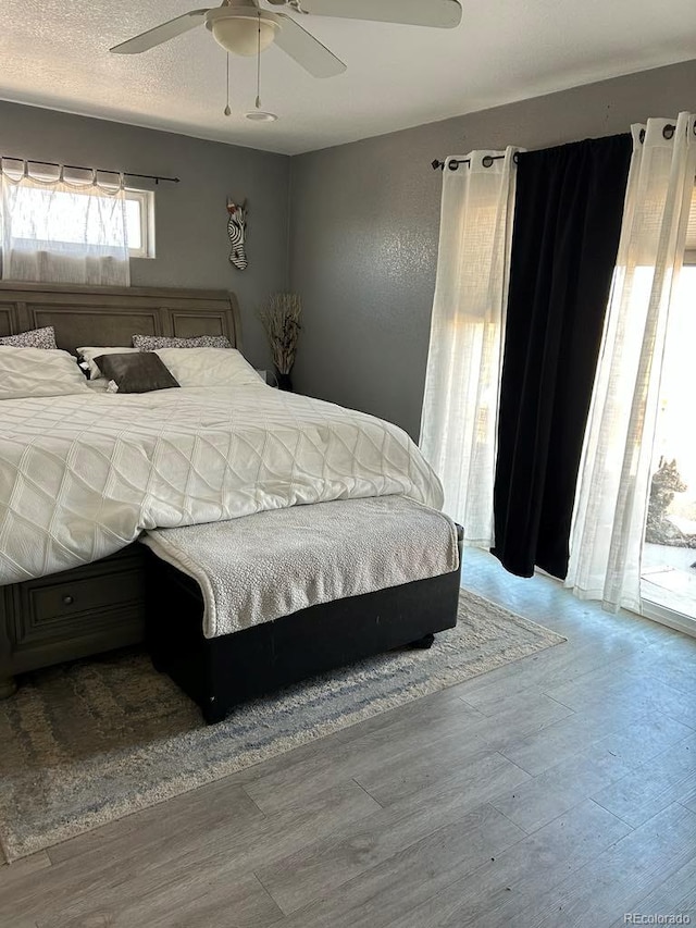 bedroom with wood finished floors and a ceiling fan