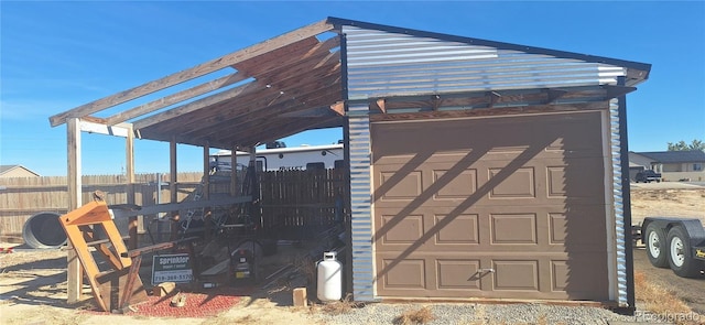 view of outdoor structure featuring fence