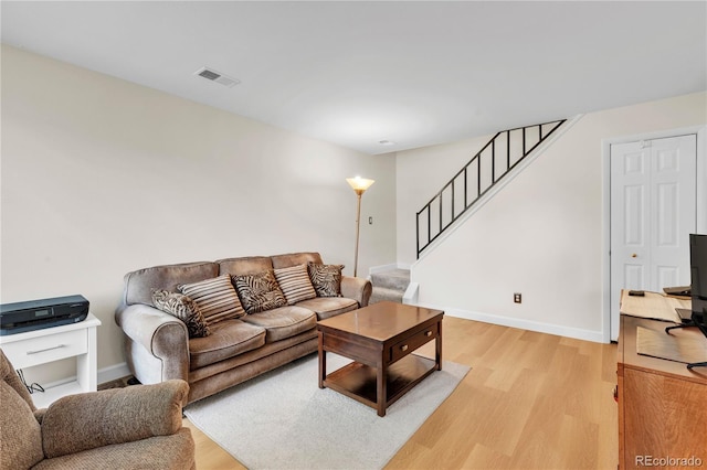 7933 Chase Cir Unit 182, Arvada, CO 80003 - living room featuring light wood-type flooring and stairs