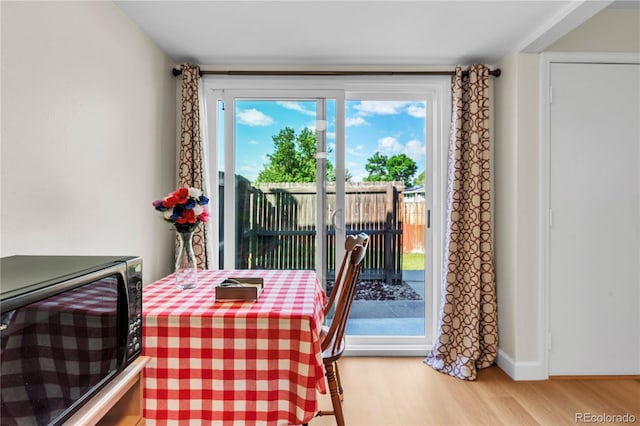 7933 Chase Cir Unit 182, Arvada, CO 80003 - dining room featuring wood finished floors and baseboards